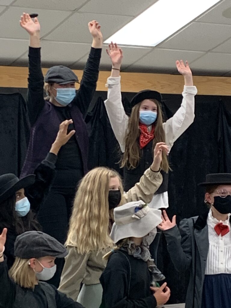 a group of kids during a performance of Mary Poppins musical